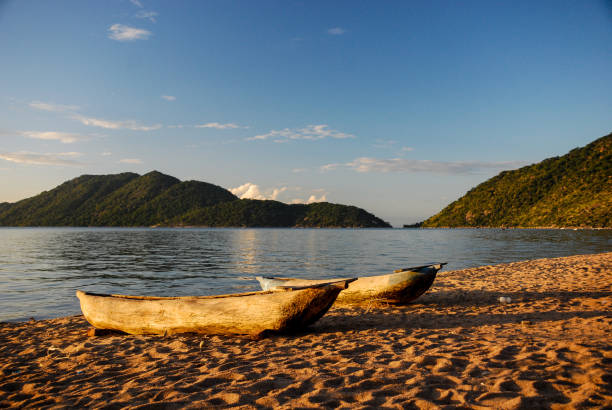 Lake Malawi with mountains and canoe