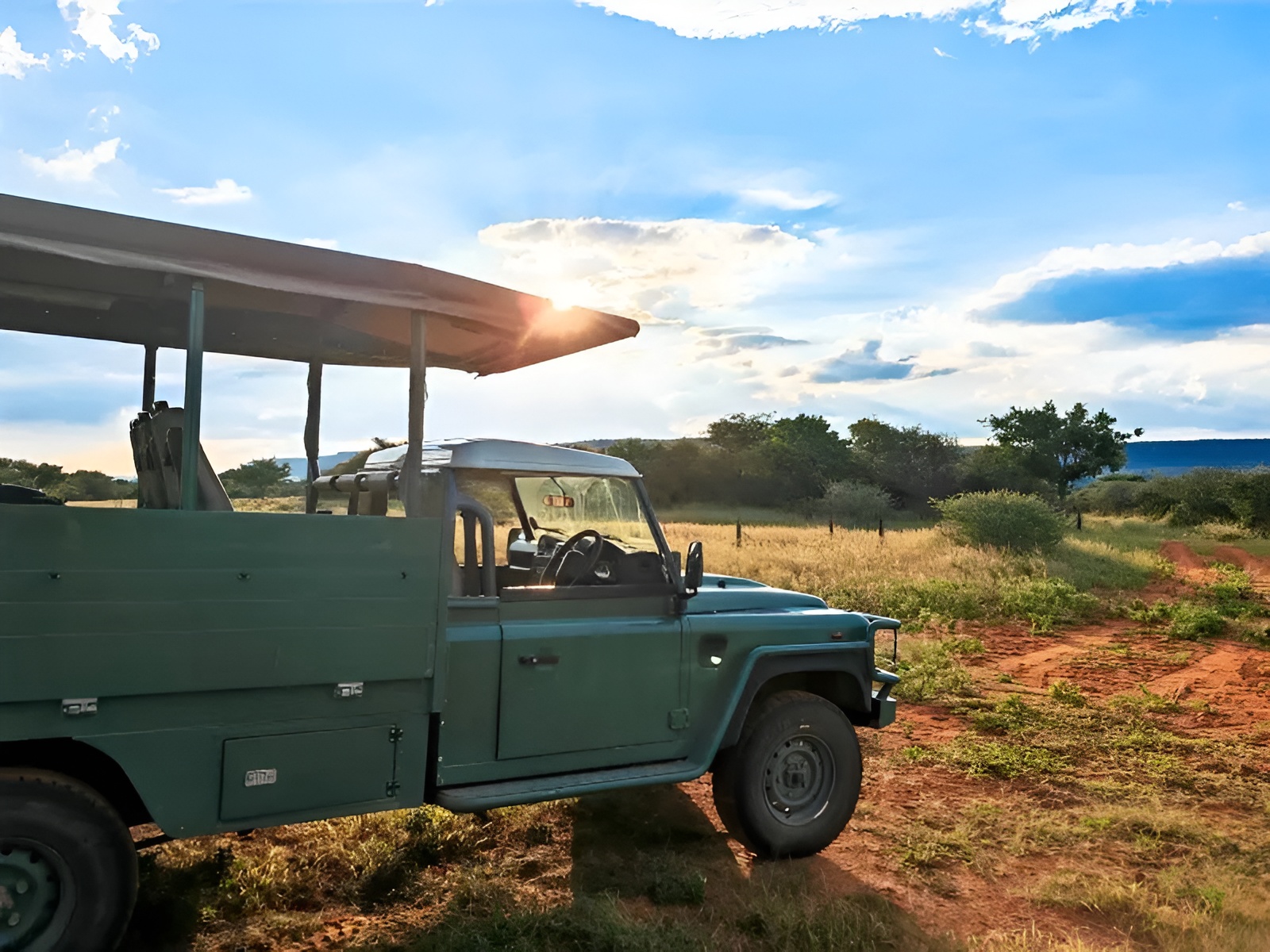 Safari vehicle travelling through the African wilderness