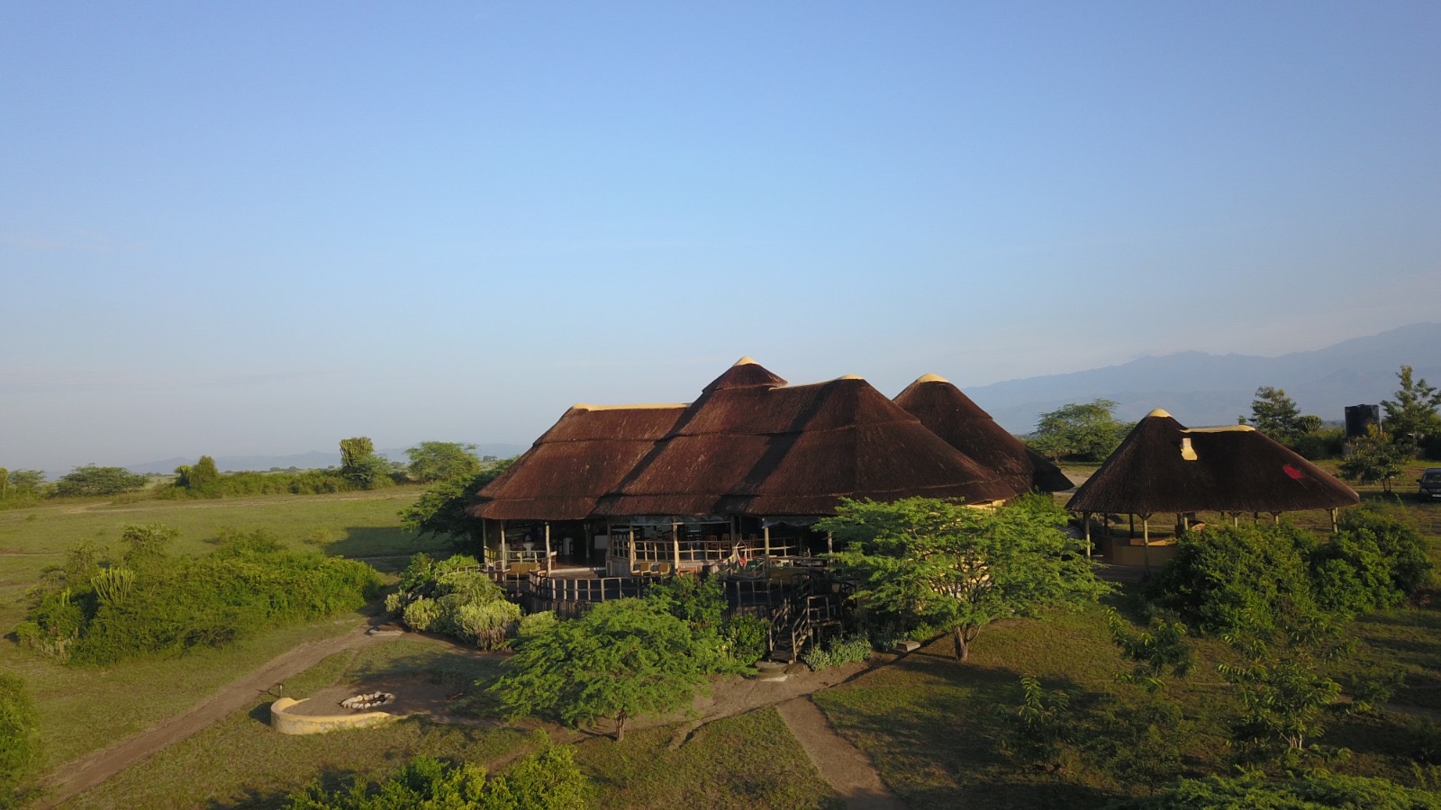Safari camp overlooking an African wilderness landscape